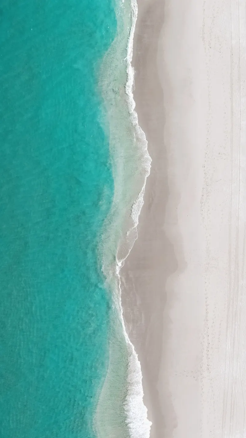 Turquoise water meeting a South Florida beach